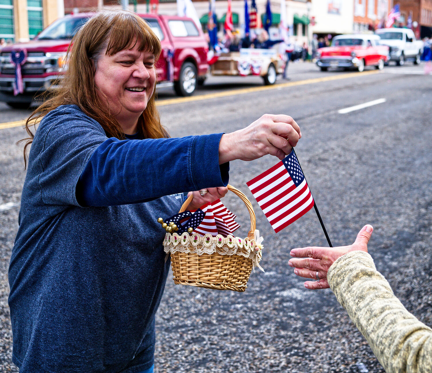 Attendees at the Veterans Day parade could receive a free flag to wave. [various Veterans Day views]